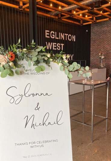 melrose flower lab wedding sign at eglinton west brewery beautifully decorated with flowers